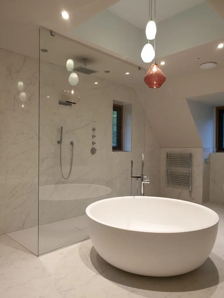 tub and glass door shower